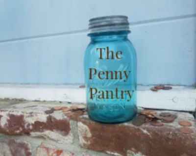 blue mason jar with text that says The Penny Pantry next to pennies