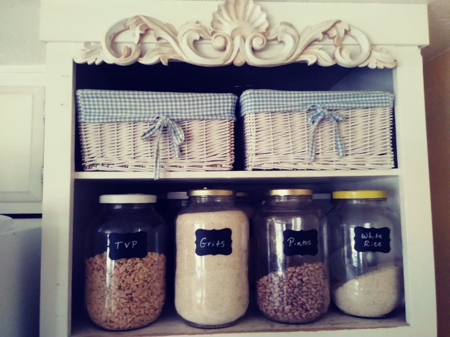 glass canisters above my oven with chalkboard labels