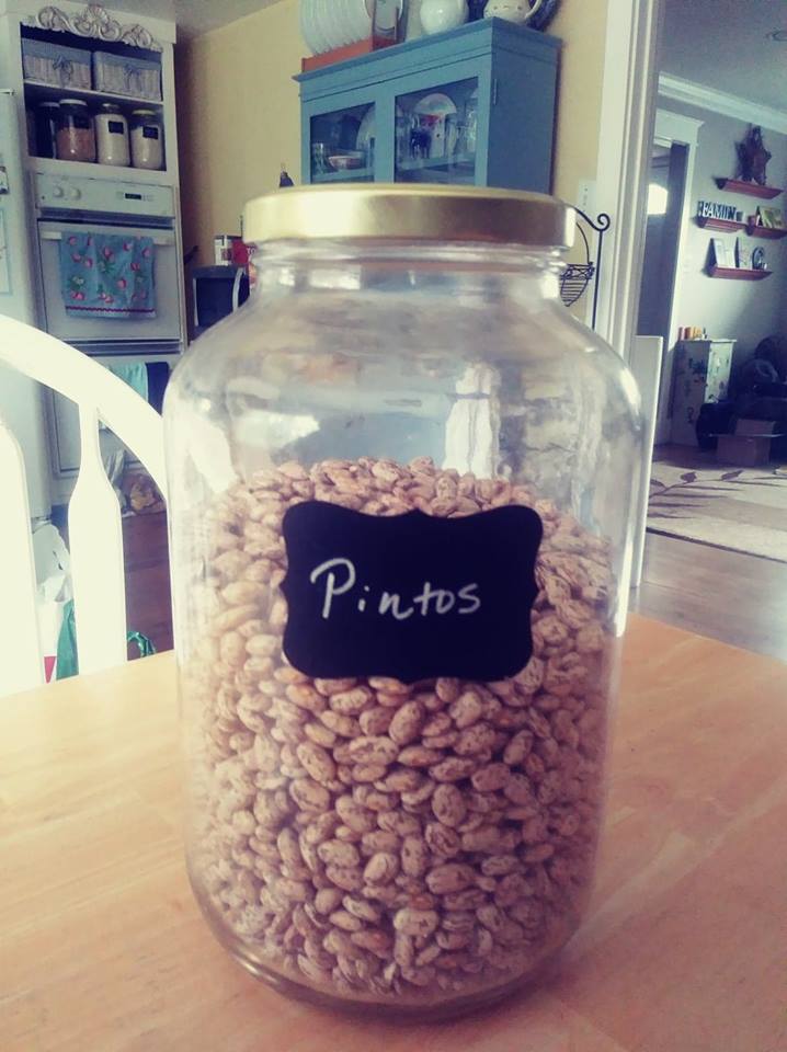 glass canister marked pintos on chalkboard label