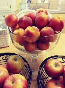 Peaches & Apples in decorative glass and metal containers