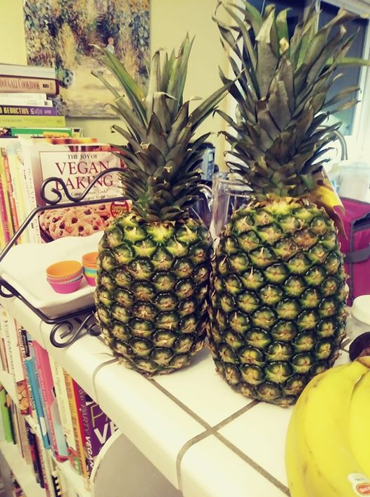 two pineapples on counter