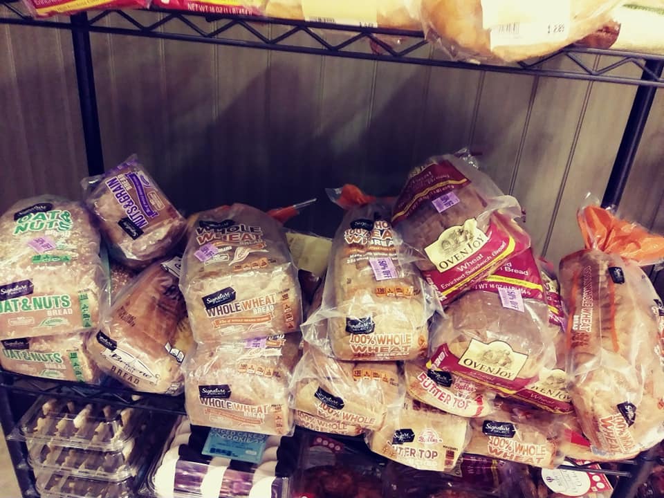 pile of Safeway bread on rack
