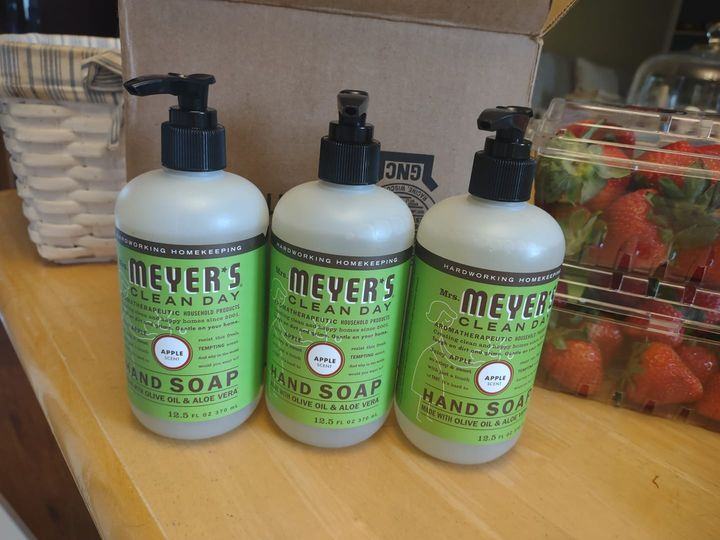three bottles of Mrs. Meyer's apple soap