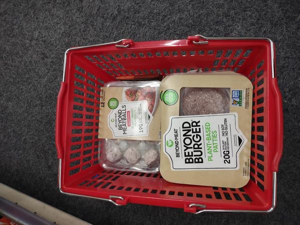 packs of Beyond Meat burgers and meatballs in CVS red basket