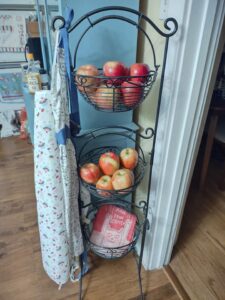 apples in 3 tiered wire basket wire basket