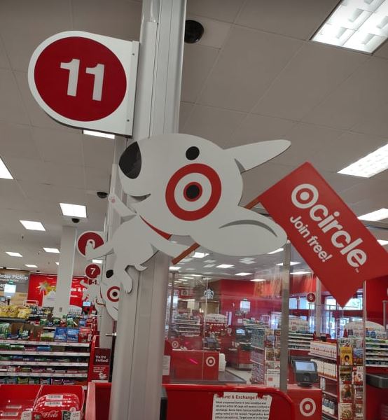sign at Target register with dog that says "circle join for free"