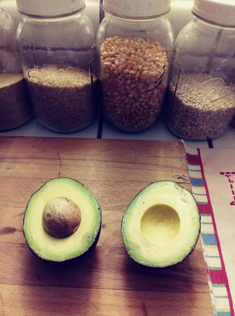 avocado sliced open on my cutting board