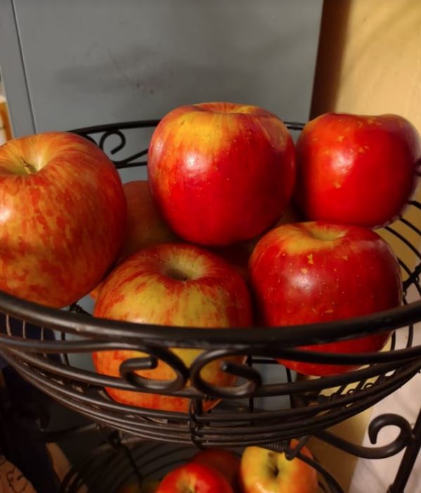 apples in black wire basket