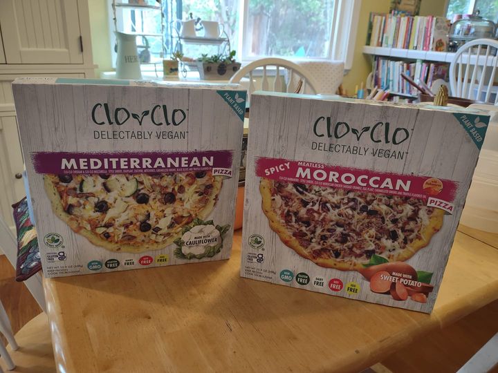 boxes of Clo Clo vegan pizzas on my table