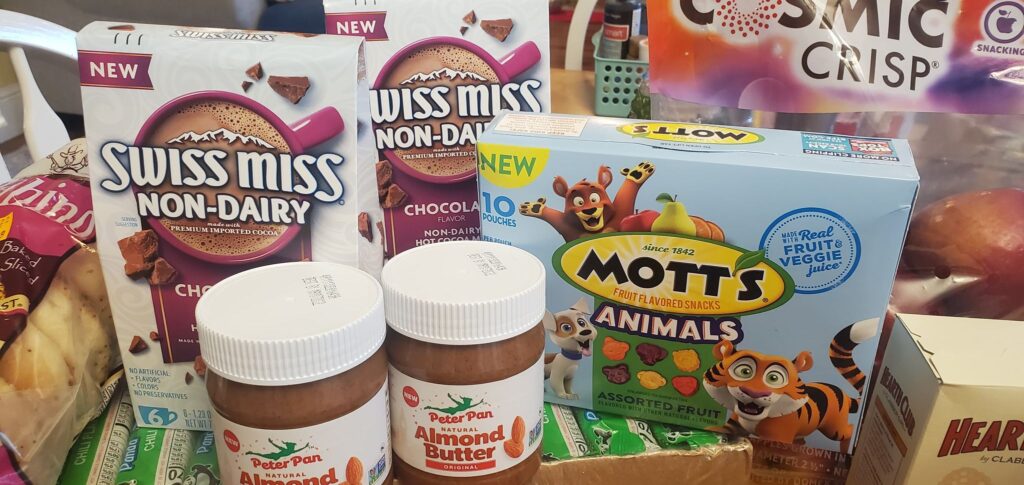 Swiss Miss non-dairy packs, Mott's fruit snacks animal shaped, Peter Pan almond butter jars
