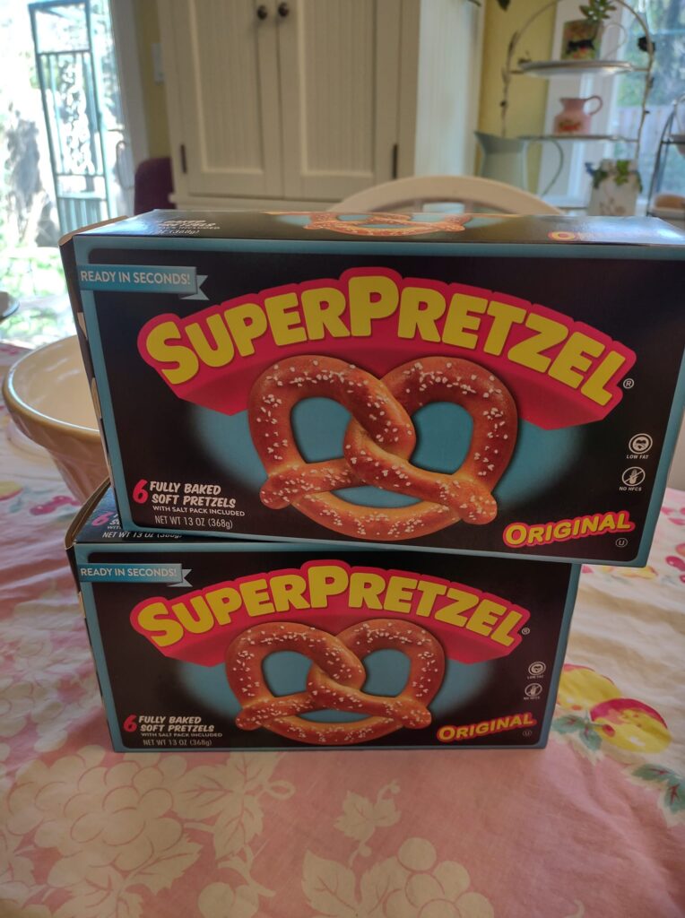 two boxes of Super Pretzels on my table with pink tablecloth