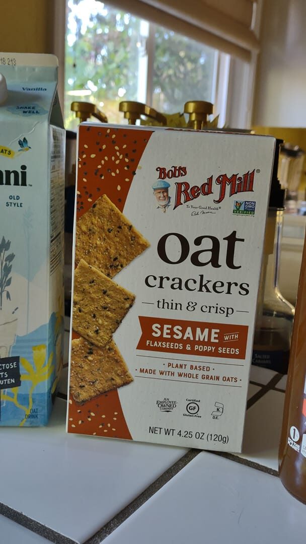 Chobani oatmilk, ob's oat crackers and bottle of Honest Tea