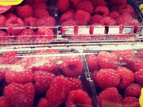 Strawberries in plastic containers at grocery store