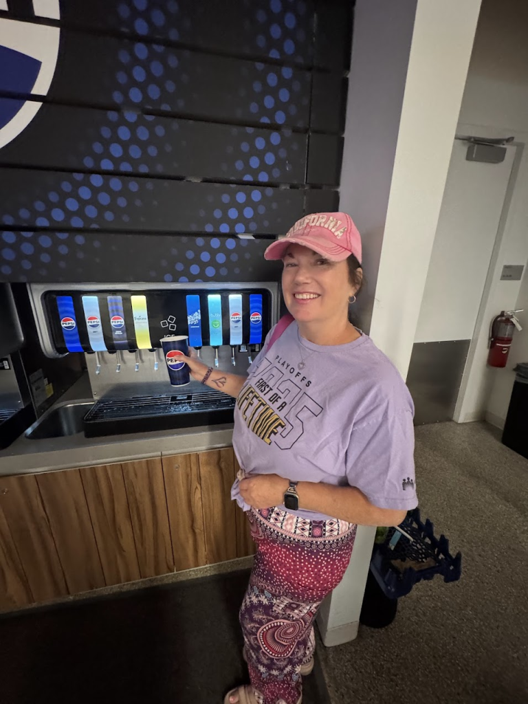 Me getting soda at the soda machine at the Chase Center
